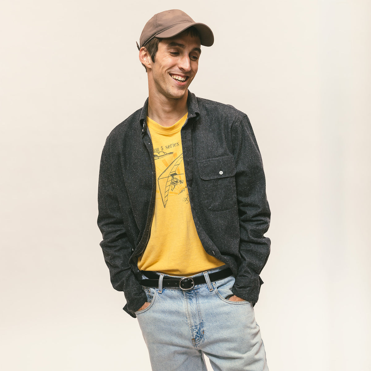 Charcoal Silk Denim sport shirt worn by a model, showcasing its silk denim fabric, button-down collar, and classic menswear fit.