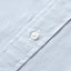 A closeup of the placket and mother of pearl button.
