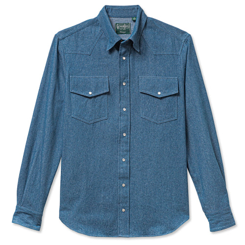 A light denim western shirt with two chest pockets and pearl snap buttons barrel cuffs made in the USA.