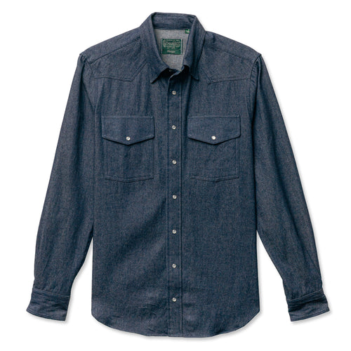 A dark denim western shirt with two chest pockets and pearl snap buttons barrel cuffs made in the USA.