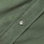 A sage corduroy fabric placket, with a white pearl button.