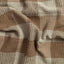 A closeup of the tan waffle checkered fabric