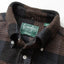 The black waffle collar with white buttons and a green Gitman Vintage tag.