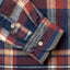 The sleeve of the red winter madras shirt.