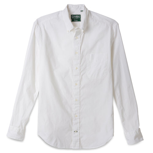 The White Ultralight Oxford button down shirt made from 80s single yarn cotton with barrel cuffs, a chest pocket, and white buttons.