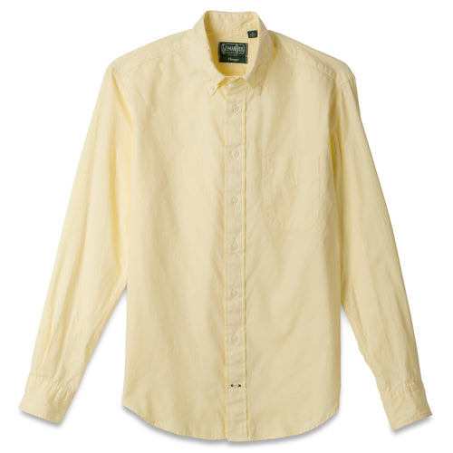 The Yellow Ultralight Oxford button down shirt made from 80s single yarn cotton with barrel cuffs, a chest pocket, and white buttons.