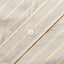 A white button on the lined placket.