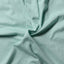 Close-up of the Teal Brushed Chambray sport shirt's brushed chambray fabric, showcasing its soft texture and rich teal color.