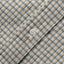 Close-up of the Ecru Brushed Dobby Check sport shirt's button placket featuring classic buttons and soft brushed dobby fabric.