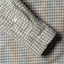Close-up of the Ecru Brushed Dobby Check sport shirt's lined cuff and buttons, showcasing its soft brushed dobby fabric and check pattern.