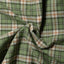 Close-up of the Green Brushed Dobby Check sport shirt's brushed dobby fabric, showcasing its soft texture and classic green check pattern.