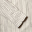 Close-up of the Ecru Brushed Dobby Stripe sport shirt's lined cuff and buttons, showcasing its soft brushed dobby fabric and stripe pattern.