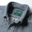 Close-up of the Blue Nepped Chambray sport shirt's button-down collar featuring a lined collar and classic button detail.