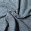 Close-up of the Blue Nepped Chambray sport shirt's nepped chambray fabric, showcasing its distinctive texture and blue color.