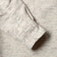 Close-up of the Ecru Nepped Chambray sport shirt's lined cuff and buttons, showcasing its textured nepped chambray fabric.