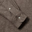 Close-up of the Brown Nepped Chambray sport shirt's lined cuff and buttons, showcasing its textured nepped chambray fabric.