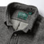 Close-up of the Charcoal Nepped Chambray sport shirt's button-down collar featuring a lined collar and classic button detail.