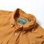 Close-up of the Gold 16-Wale Corduroy sport shirt's button-down collar featuring a lined collar and classic button detail.