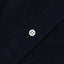 Close-up of the Navy 16-Wale Corduroy sport shirt's button placket featuring classic buttons and fine-wale cotton corduroy fabric.