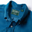 Close-up of the Blue 16-Wale Corduroy sport shirt's button-down collar featuring a lined collar and classic button detail.