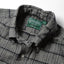 Close-up of the Prince of Wales Tweed sport shirt's button-down collar featuring a lined collar and classic button detail.