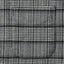 Close-up of the Prince of Wales Tweed sport shirt's chest pocket, showcasing the Prince of Wales check pattern and detailed construction.