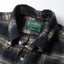 Close-up of the Navy Checked Tweed sport shirt's button-down collar featuring a lined collar and classic button detail.