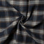 Close-up of the Navy Checked Tweed sport shirt's textured tweed fabric, showcasing its navy checked pattern and woven texture.