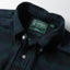 Close-up of the Blackwatch Tweed sport shirt's button-down collar featuring a lined collar and classic button detail.