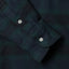 Close-up of the Blackwatch Tweed sport shirt's lined cuff and buttons, showcasing its textured woven tweed fabric.