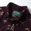 Close-up of the Purple Waterfowl Corduroy sport shirt's button-down collar featuring a lined collar and classic button detail.