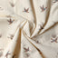 Close-up of the Ecru Waterfowl Corduroy sport shirt's cotton corduroy fabric, showcasing its distinctive ribbed texture and ecru color.