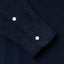The sleeve of the easy shirt with two white buttons.