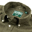 A closeup of the olive flannel collar with a button down collar and white buttons.