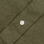 A olive flannel placket with a white button.