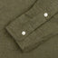 The classic olive flannel sleeve with two white buttons.